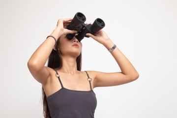 Young Asian woman with binoculars.