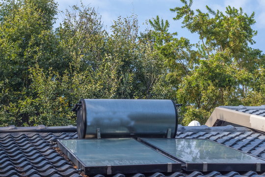 A Solar Geyser On The Roof Of A Private Home Image With Copy Space In Landscape Format