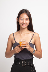Young Asian woman drink orange juice.