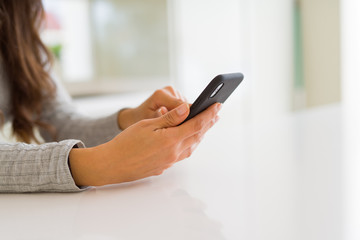 Close up of woman hands using smartphone