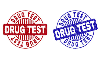 Grunge DRUG TEST round stamp seals isolated on a white background. Round seals with grunge texture in red and blue colors. Vector rubber watermark of DRUG TEST tag inside circle form with stripes.