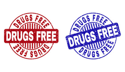 Grunge DRUGS FREE round stamp seals isolated on a white background. Round seals with grunge texture in red and blue colors.