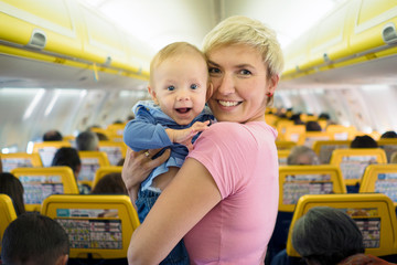 Mother with six months old baby boy in the airplane