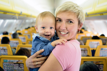 Mother with six months old baby boy in the airplane