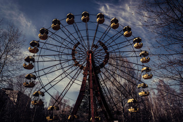 Old ferris wheel in the ghost town of Pripyat. Consequences of the accident at the Chernobil...