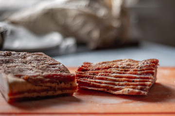 on a cutting board cut into smoked meat