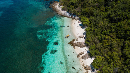 Tropical scenery aerial view in Malaysia. Perfect white sand, palm trees with turquoise water