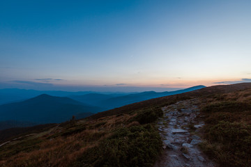 Fototapeta premium road in the evening mountains