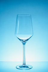glass of white wine with wave on white background