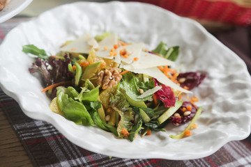 Healthy salad with avocado and walnuts
