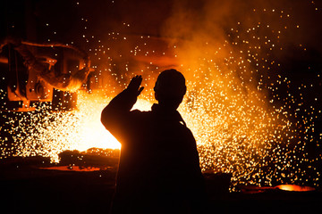 Metallurgists at casting ingots in Foundry Shop, Metallurgical production