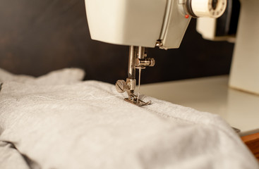 Background type of sewing machine, tailoring process. sewing workshop.