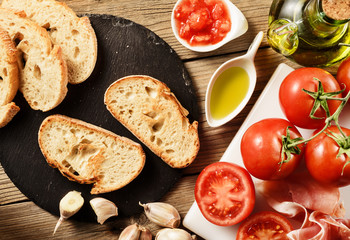 toast of spanish cured ham with tomato,garlic and olive oil