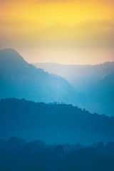 tropical forest mountain layers, sunset time with nature