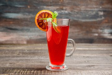 Fruit drink based on raspberry with red orange slice. Selective focus. Shallow depth of field.