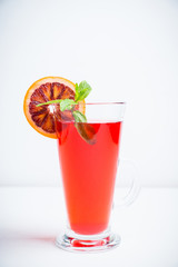 Fruit drink based on raspberry with red orange slice. Selective focus. Shallow depth of field.