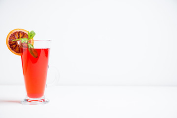 Fruit drink based on raspberry with red orange slice. Selective focus. Shallow depth of field.