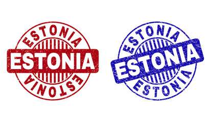 Grunge ESTONIA round stamp seals isolated on a white background. Round seals with grunge texture in red and blue colors. Vector rubber watermark of ESTONIA text inside circle form with stripes.