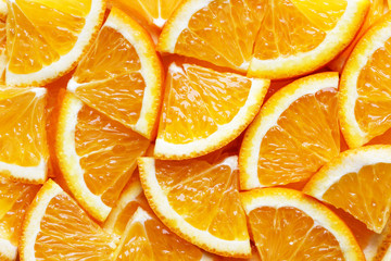 Fototapeta na wymiar juicy orange slices as a bright background