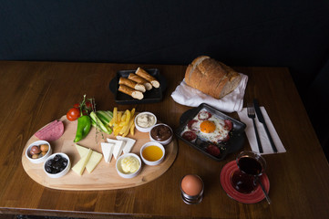 Fototapeta na wymiar at breakfast, cucumber tomato cheese olive tray