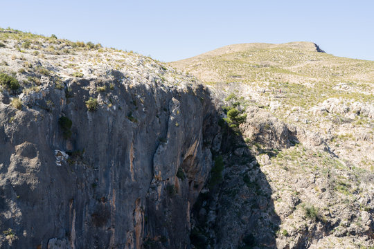 Beautiful alpine landscape, green mountain enviroment and blue sky in a sunny day
