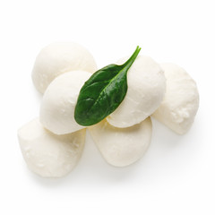 Mozzarella cheese and basil on white