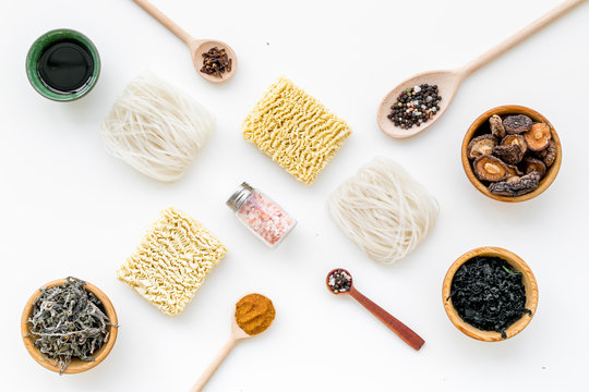 Chinese And Japanese Food Cooking With Mushrooms, Spices And Noodles On White Background Top View Geometric Pattern