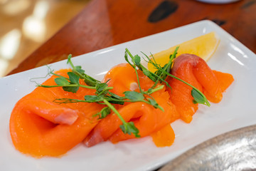 Close up shot of a plate of smoke salmon slice