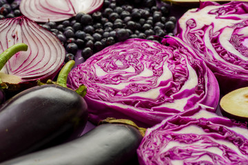 Obraz premium purple onions, eggplant, garlic, currants, red cabbage, agricultural still life in purple colors
