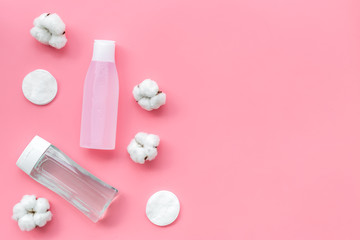 Organic cosmetics for face clearing with cotton pads, facial tonic and mycelial water pink background top view mockup