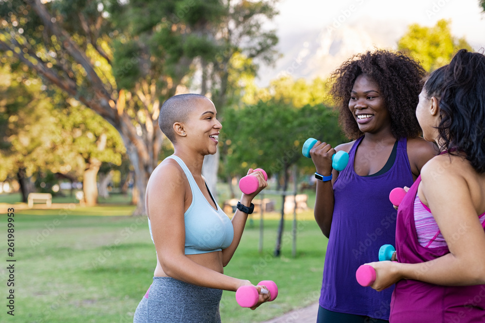 Wall mural oversize women using dumbbells