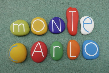 Souvenir of Montecarlo, Principality of Monaco composed with multi colored sea stones over green sand
