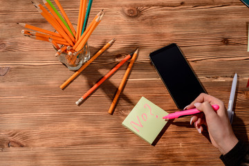 The writing a plan for medical examination. female hands with pen writing on notebook