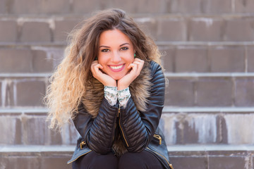 Portrait of a happy woman on stairs