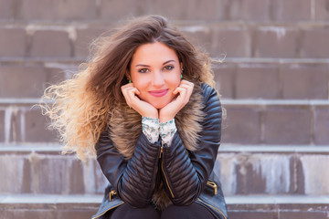 Portrait of a happy woman on stairs