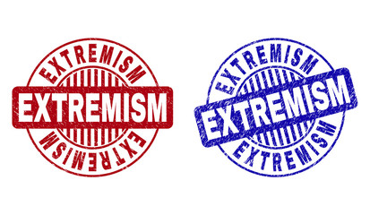 Grunge EXTREMISM round stamp seals isolated on a white background. Round seals with grunge texture in red and blue colors. Vector rubber imitation of EXTREMISM label inside circle form with stripes.