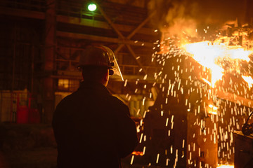 Metallurgists at casting ingots in Foundry Shop, Metallurgical production