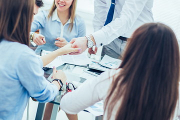 Fototapeta premium Bank Manager and the customer shake hands after signing a lucrative contract