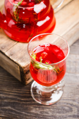 Hot raspberry beverage with rosemary. Selective focus. Shallow depth of field.