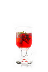 Hot raspberry beverage with rosemary. Selective focus. Shallow depth of field. Isolated on white background.