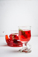 Hot raspberry beverage with rosemary. Selective focus. Shallow depth of field.