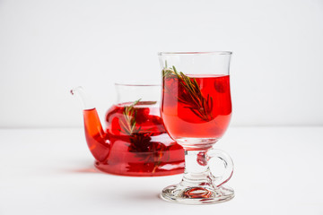 Hot raspberry beverage with rosemary. Selective focus. Shallow depth of field.