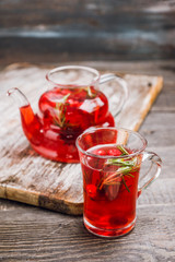 Hot raspberry beverage with rosemary. Selective focus. Shallow depth of field.
