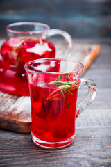 Hot raspberry beverage with rosemary. Selective focus. Shallow depth of field.