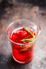 Hot raspberry beverage with rosemary. Selective focus. Shallow depth of field.