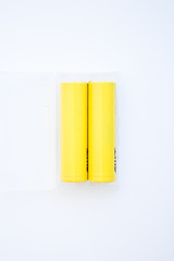 Yellow rechargeable batteries on the white background
