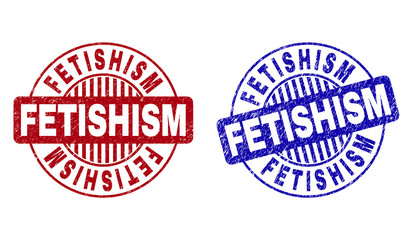 Grunge FETISHISM round stamp seals isolated on a white background. Round seals with distress texture in red and blue colors. Vector rubber watermark of FETISHISM text inside circle form with stripes.