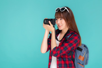 Beautiful young asian woman smiling is journalist photographer wear fashion travel summer, girl holding camera hobby tourist and trip in vacation and holiday isolated on blue background.