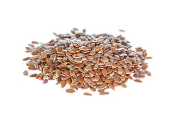 Brown flax seed on white background.