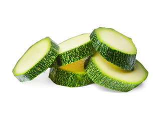 A few pieces of ripe zucchini on a white isolated background. Close-up. Side view.